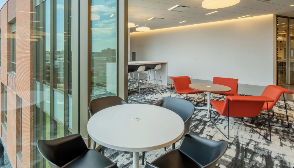 Tables and chairs in a bright university study area