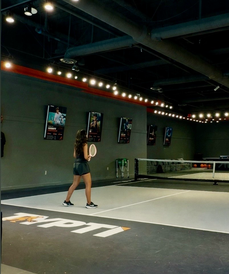 Valeria on the Typti court with the Typti floor logo visible