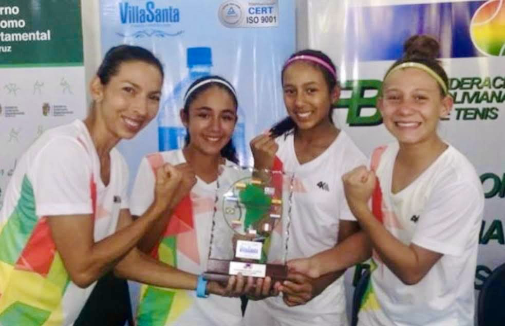 Valeria with her teammates holding the South American championship trophy