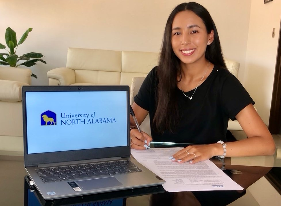 Valeria signing her scholarship with the University of North Alabama